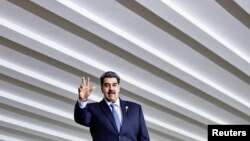 Venezuela's President Nicolas Maduro waves as he attends the South American Summit at Itamaraty Palace in Brasilia, Brazil, May 30, 2023. Maduro arrived in Saudi Arabia, June 5, 2023, state media reported.