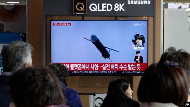 A TV screen shows a file image of North Korea's missile launch during a news program at the Seoul Railway Station in Seoul, South Korea, Feb. 14, 2024.