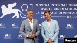 Cast members Brad Pitt and George Clooney pose during a photocall for the movie "The Wolfs" out of competition, at the 81st Venice Film Festival, Venice, Italy, Sept. 1, 2024. 