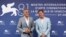 Cast members Brad Pitt and George Clooney pose during a photocall for the movie "The Wolfs" out of competition, at the 81st Venice Film Festival, Venice, Italy, Sept. 1, 2024. 