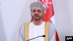 FILE - Omani Foreign Minister Sayyid Badr al-Busaidi listens during a press conference in Muscat, Oct. 10, 2023.