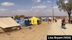 FILE - A general view of the tent camp that tour guide Abdesamat El Gzouri helped establish in the town of Amizmiz for people left homeless by the Sept. 8, 2023, earthquake in Morocco.