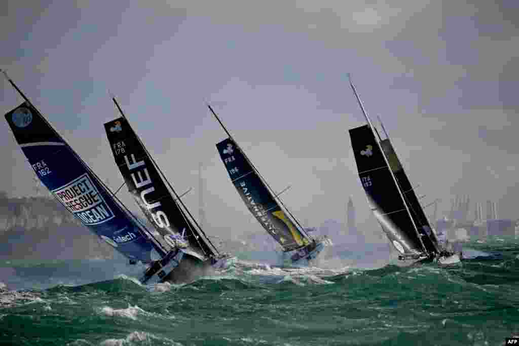 Class 40 monohulls Project Rescue Ocean (L), SNEF, and Alternative Sailing sail at the start of the Jacques Vabre pair sailing race, from Le Havre to the French overseas island of La Martinique, in Le Havre.