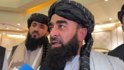 Zabihullah Mujahid, chief Taliban spokesperson, talks with reporters in Doha, Qatar, June 30, 2024.