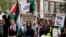 People demonstrate outside the Peace Palace in The Hague, Netherlands, in support of Palestinians on the day Nicaragua asked the International Court of Justice to order Berlin to halt military arms exports to Israel, April 8, 2024. 