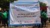 HIV activists hold up a banner during a gathering at Nyakuron Cultural Center in Juba, South Sudan to mark World AIDS Day, Dec. 1, 2023.