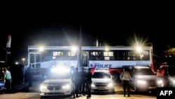 Vehicles from Johannesburg Metro Police Department (JMPD) and South Africa Police Service (SAPS) are seen in Diepsloot area, Johannesburg, during a joined operation against the high level of criminality in the area, Oct. 22, 2022.