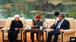 Treasury Secretary Janet Yellen, left, speaks as Chinese Premier Li Qiang, right, listens during a meeting at the Great Hall of the People in Beijing, China, July 7, 2023.