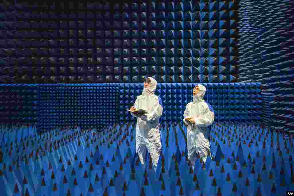 Technicians are seen testing a new material at a company in Ningbo, in China&#39;s eastern Zhejiang province.