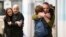Hostages Fernando Marman, right, and Louis Har, second from left, hug relatives after being rescued from captivity in the Gaza Strip, at the Sheba Medical Center in Ramat Gan, Israel, Feb. 12, 2024.