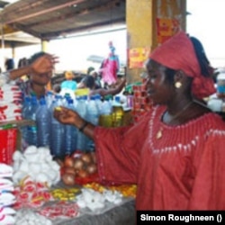 Young woman operates small business in Freetown after receiving training (Photo: Simon Roughneen)