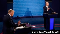 FILE — 2020 U.S. presidential candidates Donald Trump, left, and Joe Biden debate in Cleveland, Ohio, Sept. 29, 2020. At the time, Trump was U.S. President, and Biden was a former U.S. vice president. The two are also running in the 2024 U.S. presidential election.