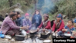 FILE - French journalist Vanessa Dougnac, center, is seen in Nepal, with some local nomads, in 2021. (Photo courtesy of Vanessa Dougnac)