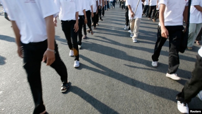 FILE - Civil society groups march as they mark the anniversary of the signing of the Universal Declaration of Human Rights in Phnom Penh, Dec. 10, 2008. Such groups fear budget shrinkage with Sweden ending development cooperation with Cambodia in 2024.