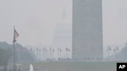 The National Mall is hazy with smoke from wildfires in Canada obscuring the view of the Capitol almost completely past the Washington Monument, as seen from the Lincoln Memorial plaza, June 29, 2023, in Washington.