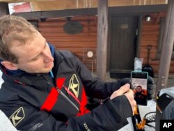 Wesley Mlaskoch describes deploying an airbag after he was caught in an avalanche in the backcountry in the Gallatin National Forest near Cooke City, Montana, Jan. 29, 2024.