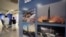 FILE - Photos showing North Korea's missiles, right, are displayed at the Unification Observation Post in Paju, South Korea, near the border with North Korea, July 20, 2023. 