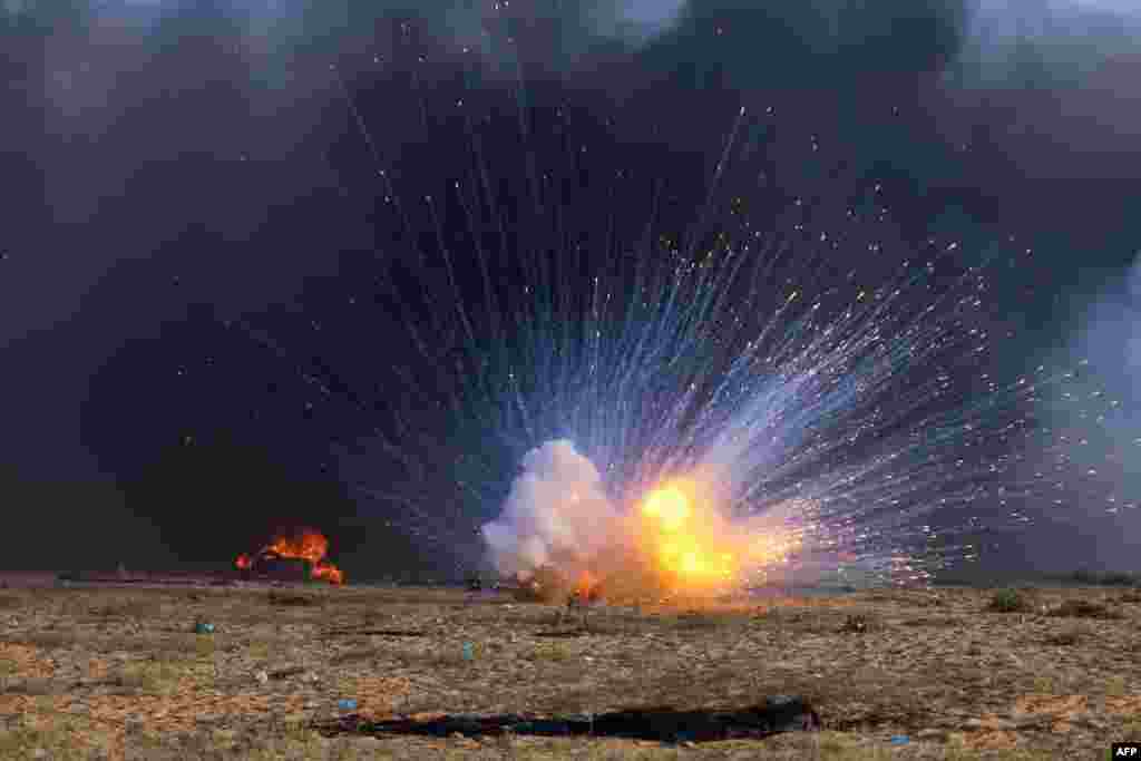 A bomb explodes during clashes between Palestinian demonstrators and Israeli security forces east of Rafah in the southern Gaza Strip near the Israel-Gaza border fence, Sept. 23, 2023.