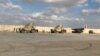 (FILE) Military vehicles of U.S. soldiers are seen at an air base in Iraq. 