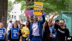 People demonstrate in Lafayette Park across from the White House in Washington, June 30, 2023, after the Supreme Court ruled that the Biden administration overstepped its authority in trying to cancel or cut student loan debts for millions of Americans.