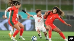 Vietnam's Thi Bich Thuy Nguyen is fouled by Portugal's Andreia Jacinto, right, during the Women's World Cup Group E soccer match between Portugal and Vietnam in Hamilton, New Zealand, July 27, 2023.