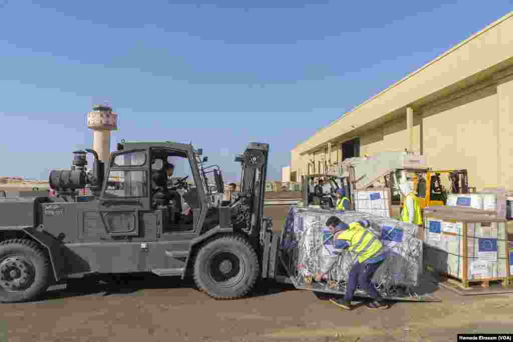 Egyptian Red Crescent volunteers receive the life-saving shipments in Al-Arish as relief agencies worldwide warn of widespread hunger in aid-reliant Gaza and more civilian deaths from diseases than bombings.