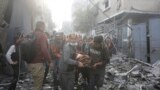 Palestinians evacuate wounded in Israeli bombardment Rafah, Gaza Strip, Dec. 1, 2023. 