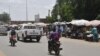 A general view of a street appearing calm with traffic normal in Niamey on July 26, 2023 as Nigerien President Mohamed Bazoum is held by guards according to a source close to Bazoum.