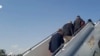Released U.S. prisoners board a plane from Tehran, Iran to Doha, Qatar, Sept. 18, 2023.
