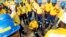 South African firefighters gather for a safety briefing in Fox Creek, Alberta, on Tuesday, July 4, 2023. Several countries, including South Africa, deployed firefighters to Canada to help local efforts to control widespread wildfires. 