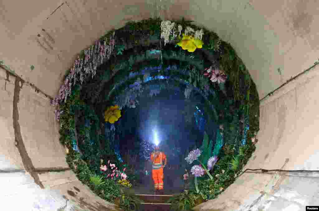 Engineer Jason Lyon views Loo Garden, a temporary subterranean garden designed to represent a future healthier River Thames, in London, Britain, on June 29, 2023. The section of the Thames Tideway Tunnel &mdash; commonly known as the &quot;Super Sewer&quot; &mdash; is a 25-kilometer tunnel being built across London under and along the River Thames to deal with combined sewer overflows currently polluting the river.