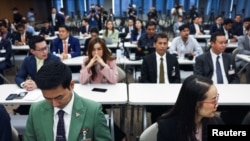 The Move Forward Party's members wait for Thailand's Constitutional Court to deliver its verdict on election winner's bid to amend a law against insulting the monarchy, in Bangkok, Thailand, Jan. 31, 2024.