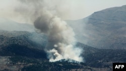 Smoke billows from forest fires near the southern Lebanese village of Shebaa, near the northern border of Israel, following the shooting down of a drone by the Israeli army on July 4, 2024.