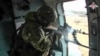 Відеокадр російського Міністерства оборони, 28 грудня 2023 року. Російський військовий в Україні стріляє з гелікоптера 