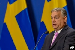 Hungarian Prime Minister Viktor Orban speaks during a press conference with his Sweden's counterpart Ulf Kristersson at the Carmelite Monastery in Budapest, Hungary, Feb 23, 2024.