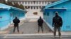 FILE - South Korean soldiers stand guard during a media tour at the Joint Security Area on the Demilitarized Zone in the border village of Panmunjom in Paju, South Korea, March 3, 2023.