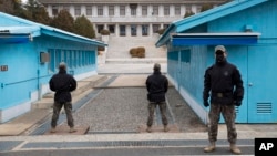 FILE - South Korean soldiers stand guard during a media tour at the Joint Security Area on the Demilitarized Zone in the border village of Panmunjom in Paju, South Korea, March 3, 2023.