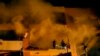 حملے میں تباہ شدہ اپارٹمنٹ میں آگ بجھانے کی کوشش کی جارہی ہے۔ فوٹو اے پی، 2 جنوری 2024