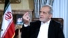 FILE - Iranian President Masoud Pezeshkian speaks in a live televised interview by state TV, at his office in Tehran, Iran, Aug. 31, 2024. (Iranian Presidency Office via AP)