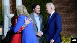 President Joe Biden and first lady Jill Biden are greeted by Canadian Prime Minister Justin Trudeau and his wife, Sophie Gregoire Trudeau, at Rideau Cottage, March 23, 2023, in Ottawa, Canada.