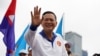 FILE - Hun Manet, son of Cambodia's Prime Minister Hun Sen, waves to people during the final Cambodian People's Party (CPP) election campaign for the upcoming general election in Phnom Penh, Cambodia, July 21, 2023. 
