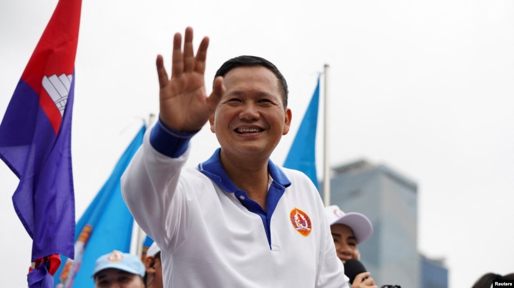 FILE - Hun Manet, son of Cambodia's Prime Minister Hun Sen, waves to people during the final Cambodian People's Party (CPP) election campaign for the upcoming general election in Phnom Penh, Cambodia, July 21, 2023. 