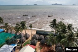 Fisherman boats are seen at the sea off the Angkoal village at the coast of Cambodia's southern Kep province, Cambodia August 17, 2023. (REUTERS/Thomas Suen)