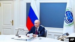 Russian President Vladimir Putin attends a meeting of the Shanghai Cooperation Organization Heads of State Council via videoconference at the Kremlin, in Moscow, Russia, July 4, 2023. (Alexander Kazakov, Sputnik, Kremlin Pool Photo via AP)