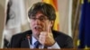 FILE - Catalonia's then-leader Carles Puigdemont speaks at a press conference in Alghero, Italy, Oct. 4, 2021. 