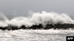 Waves are pictured near the coast in Linbian in western Pingtung County on July 26, 2023, as Typhoon Doksuri passed southern Taiwan. 