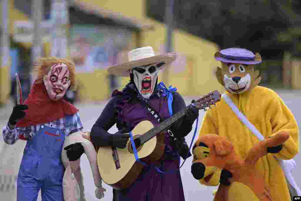 Revelers in costumes take part in the Masquerade Party, a traditional Easter celebration to celebrate the end of Holy Week in Jaboticatubas, state of Minas Gerais, Brazil, April 9, 2023.