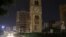 A car drives near a clock tower in Jdeideh, Lebanon, March 25, 2023. 