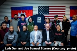 Longtime U.S. Secret Service Officer Leth Oun, who retired this year, and author Joe Samuel Starnes, in 2023 with members of the Philadelphia Cambodian American Business Community association