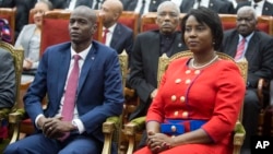 FILE - Haitian President Jovenel Moise, left, sits with his wife Martine during his swearing-in ceremony at Parliament in Port-au-Prince, Haiti, Feb. 7, 2017. Jovenel Moise was killed on July 7, 2021.